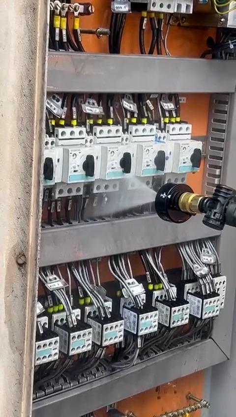 Applying the LiveCleaning nanodetergent on a live electrical panel